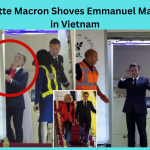 Brigitte Macron’s hands push Emmanuel Macron’s face as they exit a plane in Hanoi, Vietnam, on May 25, 2025.