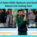 A line judge checks a ball mark on the clay court during a French Open 2025 match at Roland Garros.