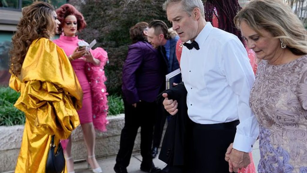 Rep. Jim Jordan and his wife Polly walk past drag performers gathered outside the Kennedy Center as President Trump’s motorcade passes.